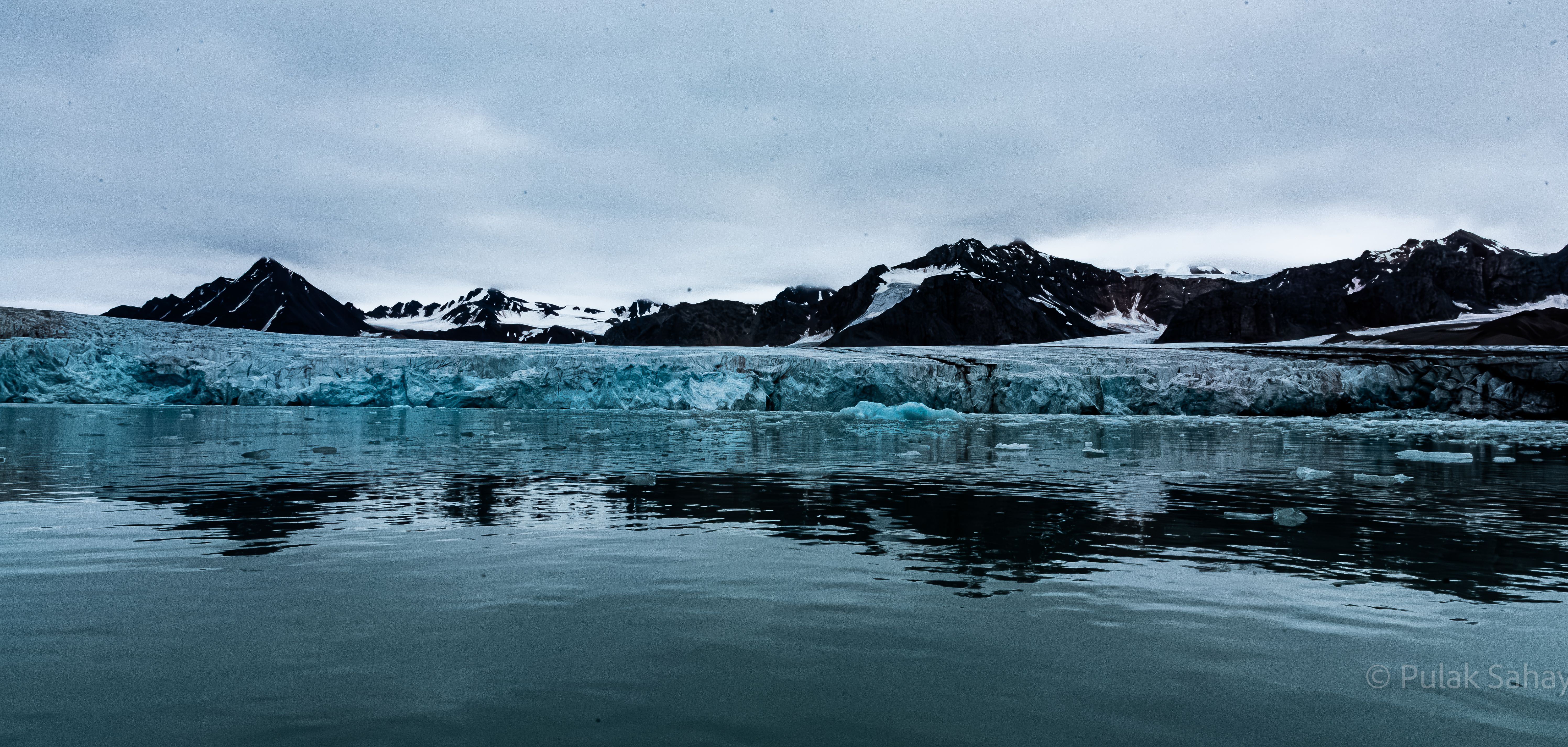Mountain reflection over glacier
